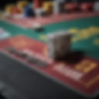 Close-up of colorful chips and cards on a blackjack table.